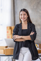 Portrait of young Asian woman SME working with a box at home the workplace.start-up small business owner, small business entrepreneur SME or freelance business online and delivery concept.