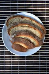 Sliced rye delicious bread on a mat. Lunch bread close-up.