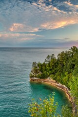 Vertical shot of a cloudy sunrise at Miners Castle in Pictured Rocks National Lakeshore, Michigan
