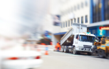 Construction and roadworks in a street during an emergency in the city. Blurred and defocused view...
