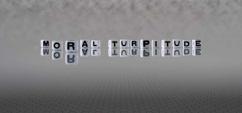 moral turpitude word or concept represented by black and white letter cubes on a grey horizon background stretching to infinity