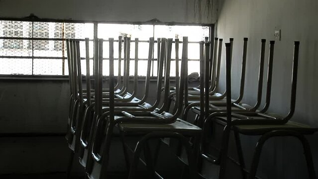 Inmate Moving School Seats in a Classroom at Olmos Prison in Buenos Aires Province, Argentina.