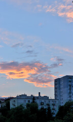 Fototapeta premium Residential building against the setting sun.