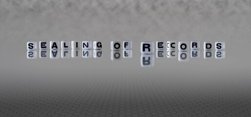 sealing of records word or concept represented by black and white letter cubes on a grey horizon...