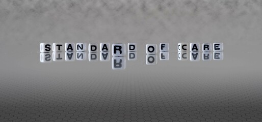 standard of care word or concept represented by black and white letter cubes on a grey horizon...