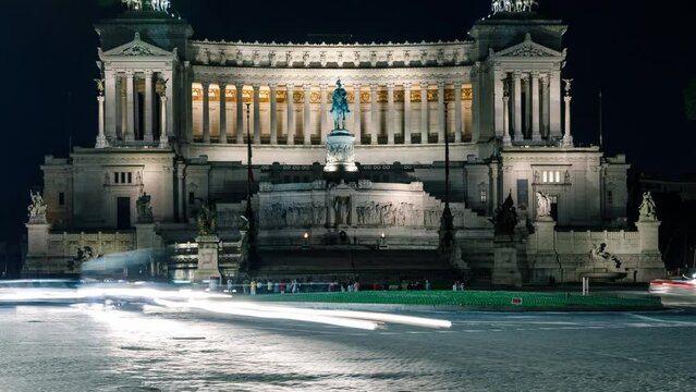 Time Lapse of traffic in Rome Italy at night with the Altar of the Fatherland in the background