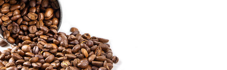 Roasted coffee beans in metal cup isolated on a white background.Copy space. Banner