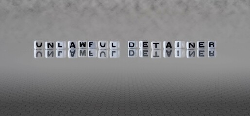 unlawful detainer word or concept represented by black and white letter cubes on a grey horizon background stretching to infinity