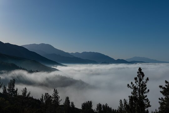 Mesmerizing View Of Mountain Tops Rise Above The Clouds Near Big Bear, California