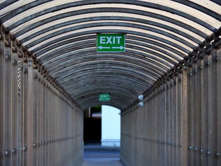 Exit sign in pedestrian tunnel