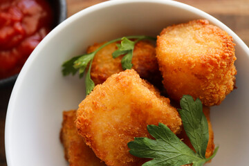 Potato tots. Breaded potato bites 