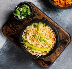 Hakka Noodles served in a dish isolated on dark background top view