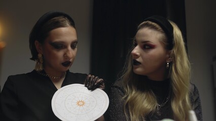 4K. A female astrologer sets forecasts for girls