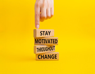 stay motivated throughout change symbol. Concept words stay motivated throughout change on wooden...