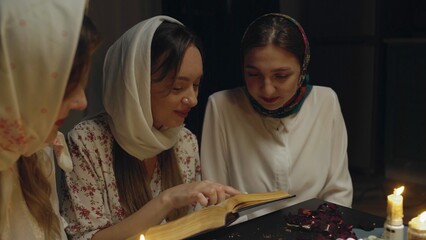 4K. Slavic women fortune-telling in a dark room by candlelight