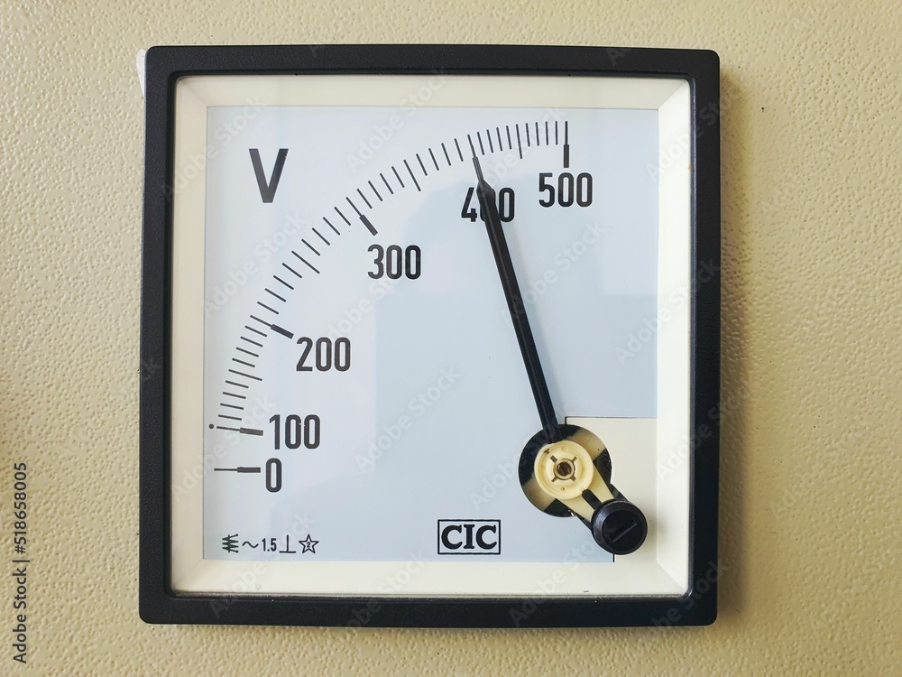 Poster analog high voltage alternating current voltmeter dial. the scale reads five hundred volts.