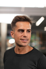Fototapeta premium Portrait of an expert personal trainer and nutritionist, at the local sports and fitness center, during a training session