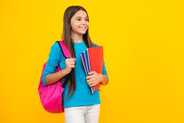 Happy teenager portrait. School teenager child girl 12, 13, 14 years old with book and copybook. Teenager schoolgirl on isolated background. Learning and knowledge education concept. Smiling girl.