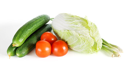 Fresh vegetables, tomatoes cucumbers cabbage and green onions, for healthy eating vegetarian, isolated on white background close-up