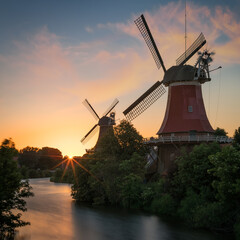 windmills in greetsiel at sunset