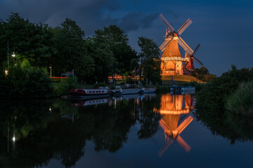 windmills in greetsiel in the evening