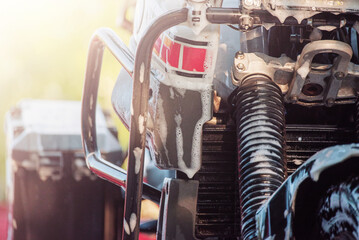 A clean wet motorcycle of the enduro class. Car wash. Transport in foam. Wet bike.