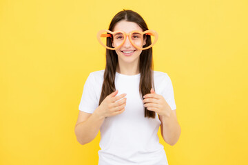 Portrait of beautiful party woman in funny carnival glasses. Excited girl.