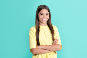 Fototapeta premium happy kid with long hair crossed hands. beauty and fashion. female fashion model.