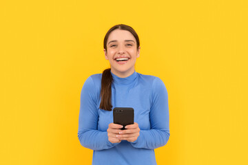 happy lady laughing at text message on smartphone, blogging
