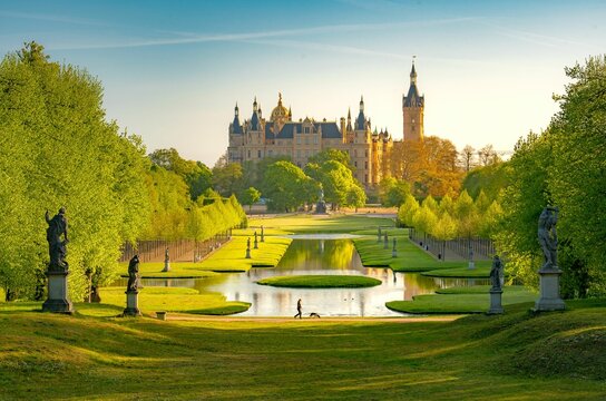 Beautiful shot of a groomed park with the background of the Schwerin Castle