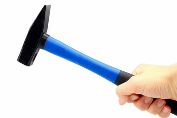 Caucasian hand holding a blue hammer
