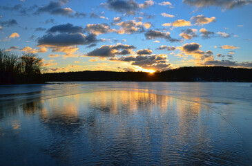 Sunrise over a river with reflection