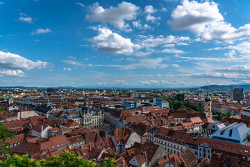 Aerial panorama view of Graz city old town from Castle Hill (Schlossberg) with city hall, main square and Franciscan Church on sunny summer day,  with blue sky cloud, Graz, Styria, Austria - 518678246