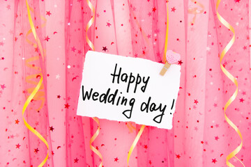 Happy wedding day - card on vibrant pink background with decorations	