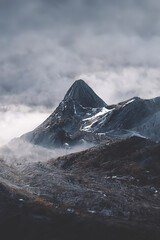 Mountain landscape. Mountain tops in fog. Fantasy landscape, mountain rocks. 3D illustration.