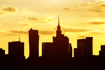 Big city skyline of Warsaw, Poland. Silhouettes Of modern skyscrapers and the famous Palace of...