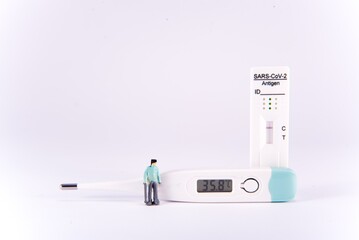 Negative covid test and thermometer with people. Covid free people. Healthy people. Diorama.