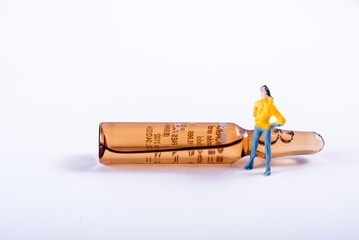 Person with ampoule. Diorama. Young woman.