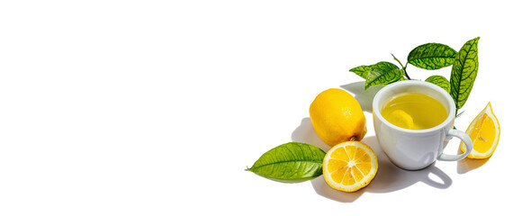 Lemon tea with ripe fruits and fresh leaves isolated on white background