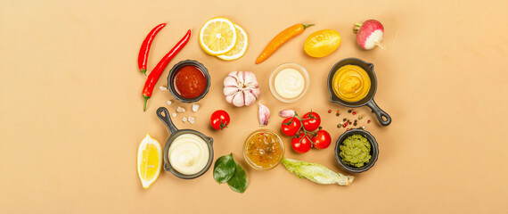 Fototapeta na wymiar Set of sauces isolated on beige background. Ketchup, mustard, mayonnaise, wasabi, sweet curry