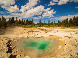 Sunny beautiful landscape of Collapsing Spring in West Thumb of Yellowstone National Park