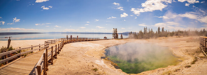 Sunny beautiful landscape of Black Pool in West Thumb of Yellowstone National Park