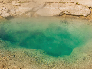 Sunny beautiful landscape of Collapsing Spring in West Thumb of Yellowstone National Park