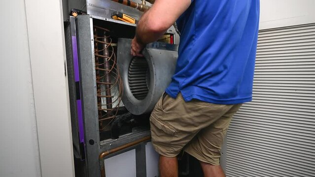 HVAC Technician Installing a Blower Motor