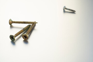 frost on wood. Self-tapping screws isolated on background