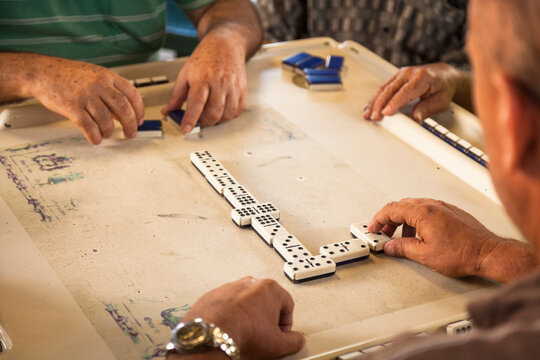 Men Playing Cuban Dominoes On Calle Ocho, Miami, Florida, USA