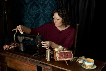 A 1920s seamstress working at her sewing machine