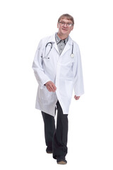 friendly doctor with a stethoscope striding forward .