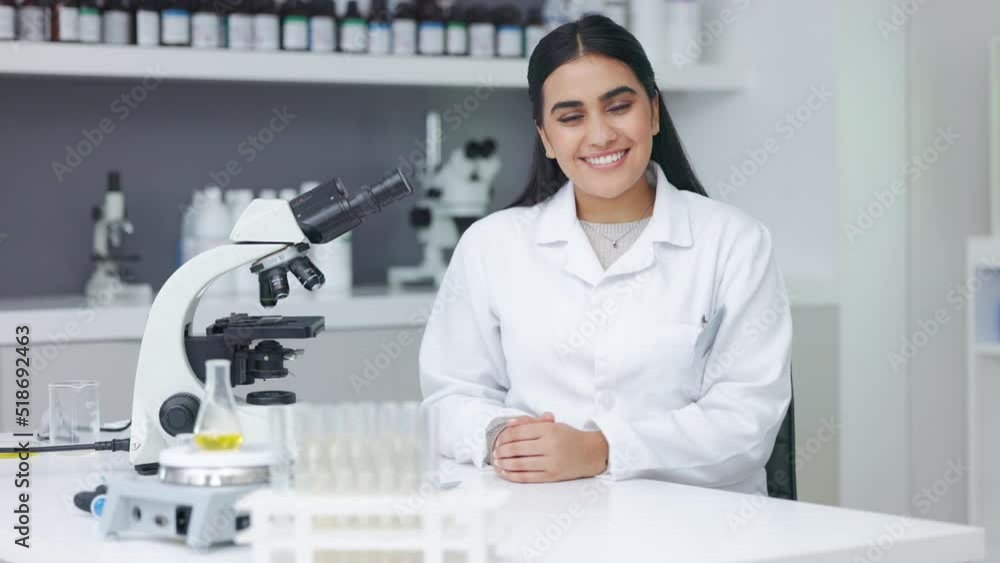 Poster young biologist analyzing microscopic samples with the latest laboratory tech equipment. portrait of