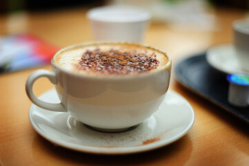 A cup of coffee, shot in a narrow depth of field